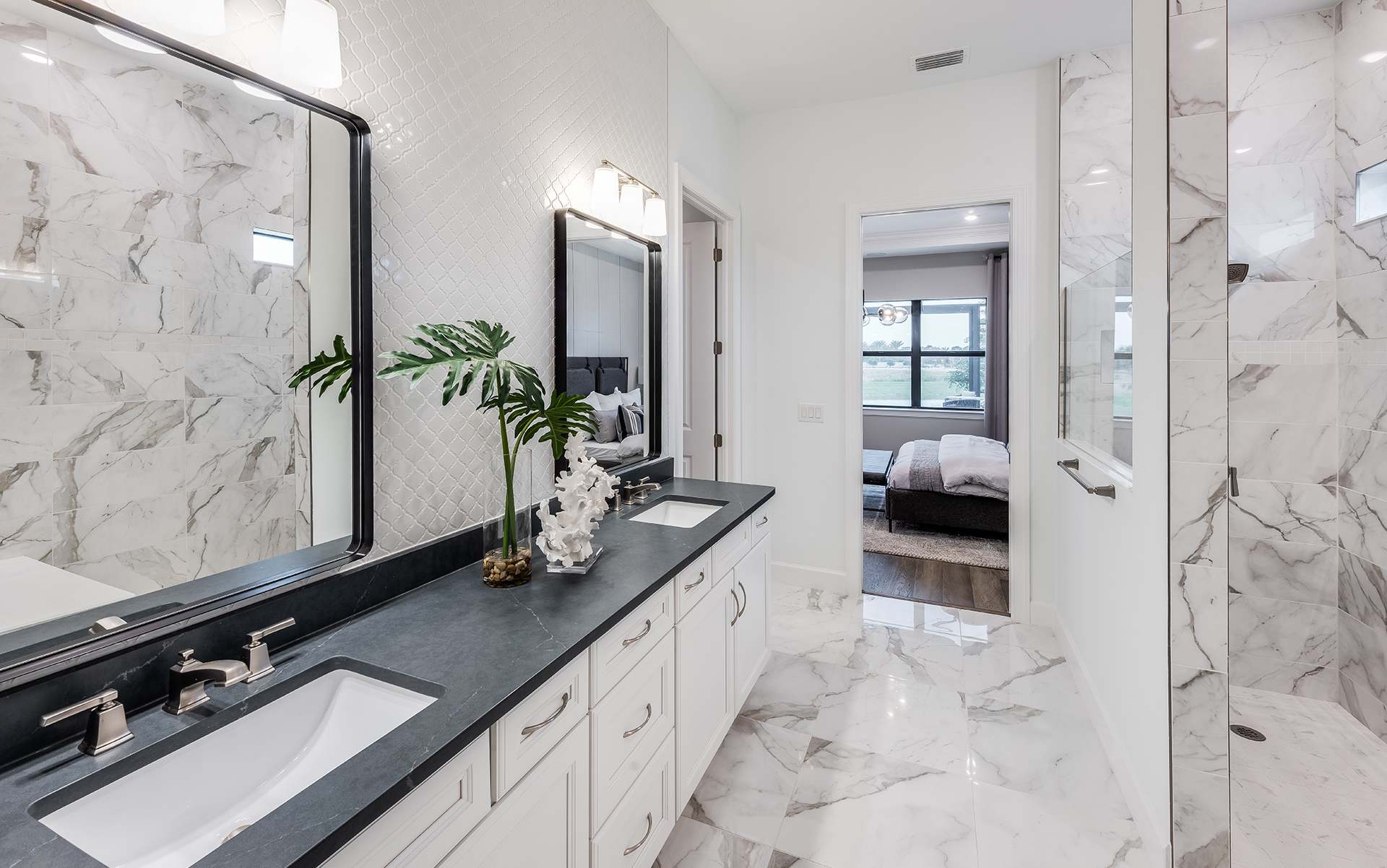 Regalia primary bath with marble tile
